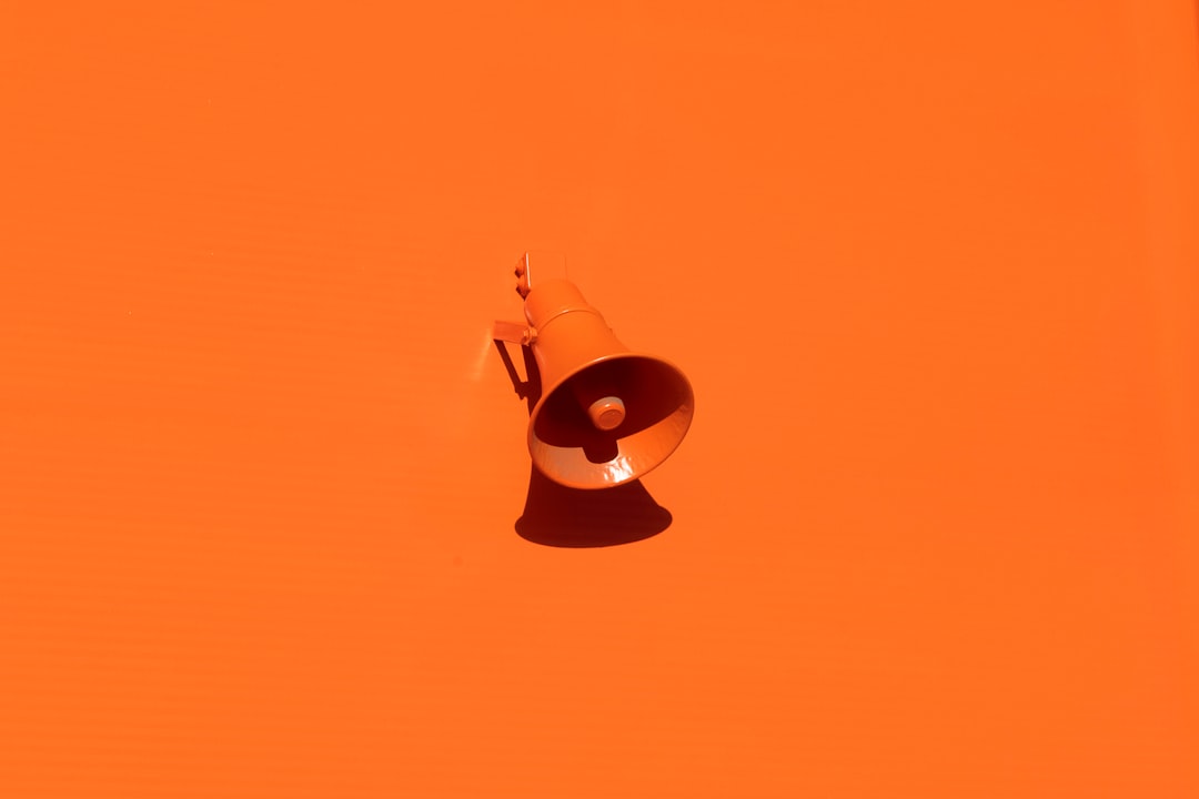 orange-megaphone-on-orange-wall-qrkjwe6yfjo
